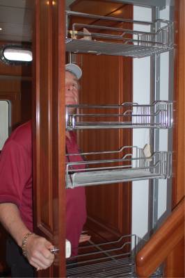Bradley examines the pantry in a Nordhavn