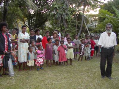 The village chief and some villagers welcome the yachties