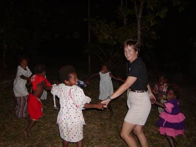 Kathy dances with her new friends