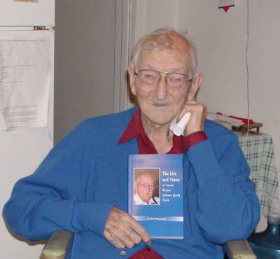 Jack proudly displays his autobiography, printed in time for his 97th birthday