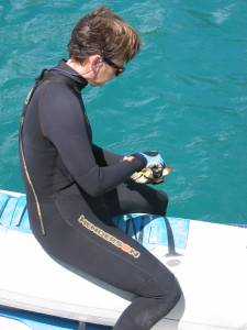 Kathy cleans scallops in preparation for another feast