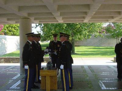 Jack's service at Arlington cemetery - he's in the urn on the table as the flag is folded above him